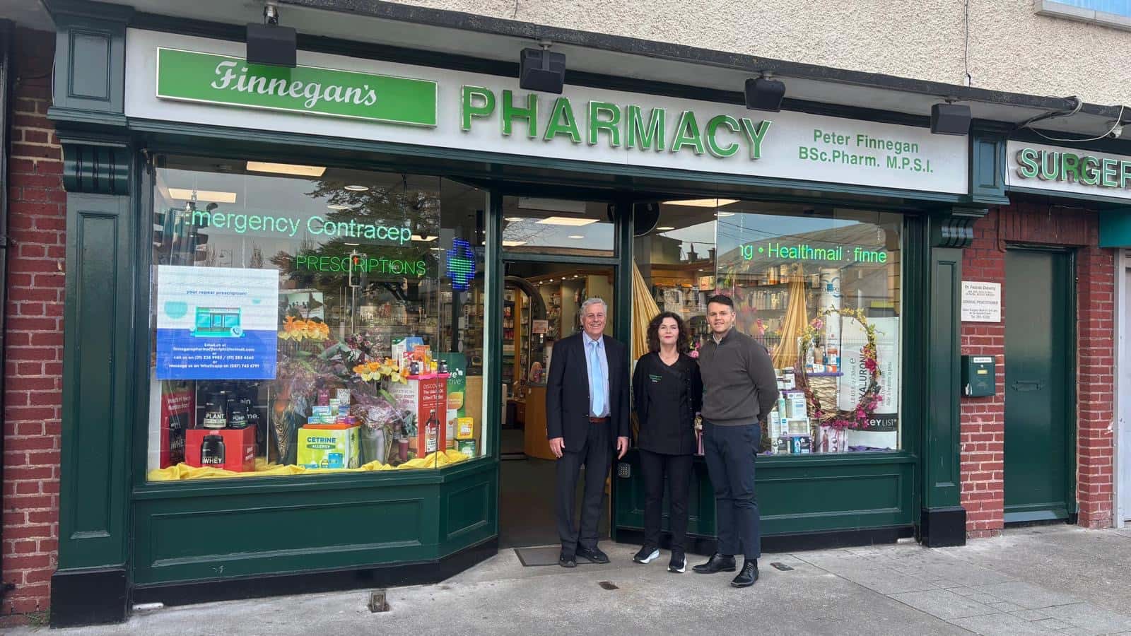 Kevin with his parents outside Finnegan's Pharmacy in Sallynoggin